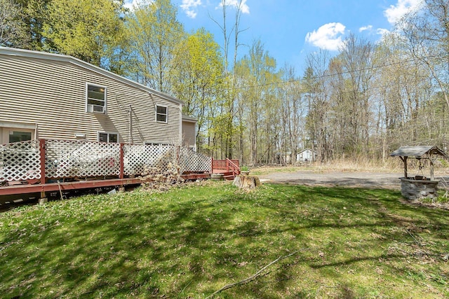 view of yard featuring a wooden deck