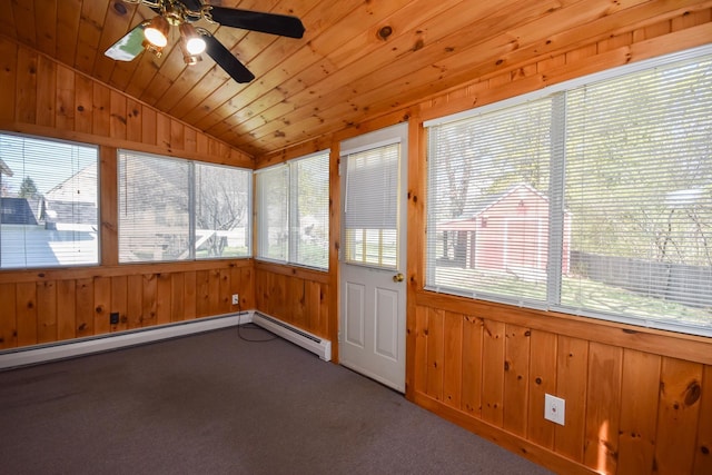 unfurnished sunroom featuring wood walls, carpet, a wealth of natural light, and lofted ceiling
