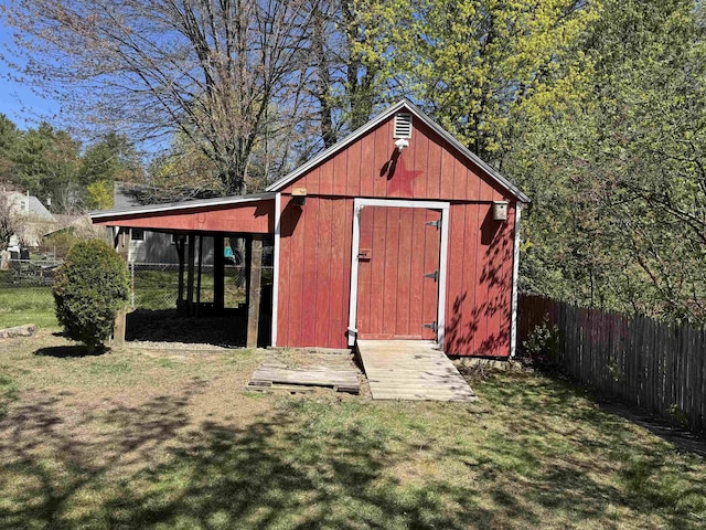view of shed with fence