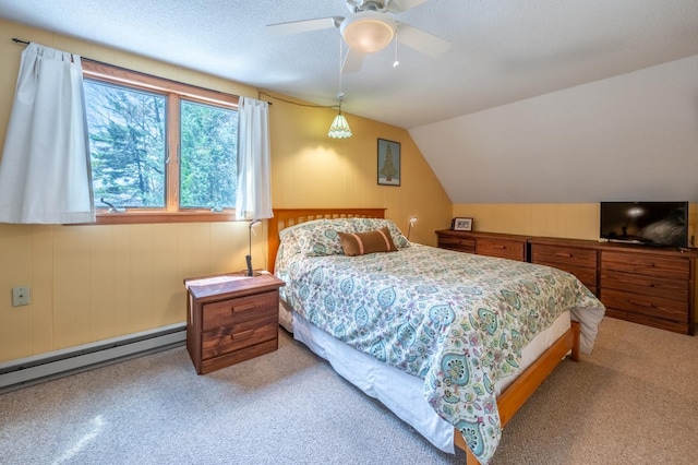 bedroom with lofted ceiling, light carpet, ceiling fan, wooden walls, and a baseboard radiator