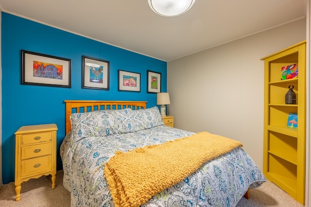 bedroom with carpet flooring and crown molding