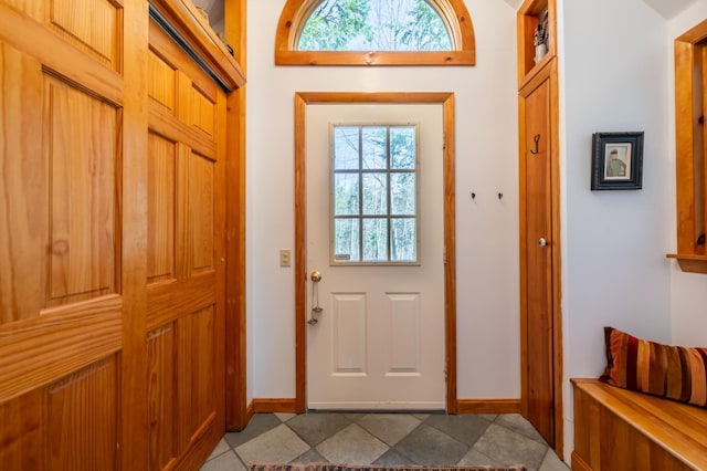 entryway with baseboards and a healthy amount of sunlight
