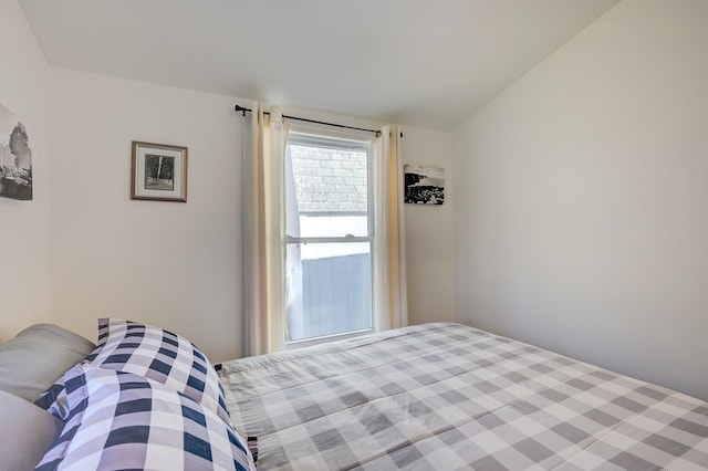 bedroom featuring lofted ceiling