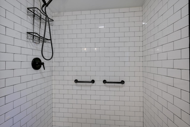 full bath featuring tiled shower