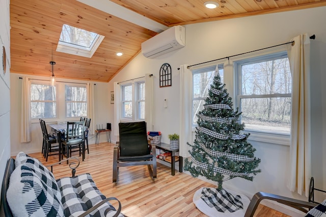living area featuring a wall unit AC, wood ceiling, vaulted ceiling with skylight, and light wood finished floors