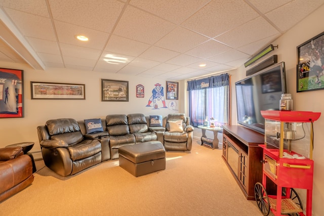 carpeted living room with recessed lighting and a drop ceiling