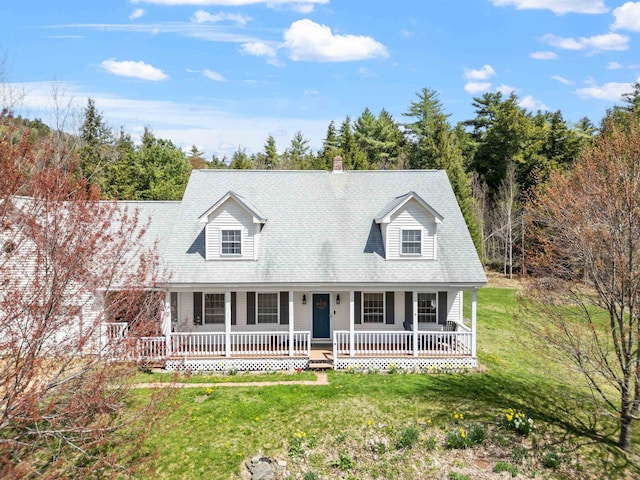 cape cod house with a porch and a front lawn