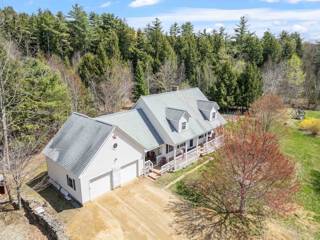 drone / aerial view featuring a forest view