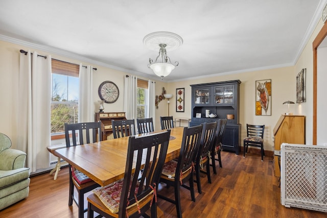dining room with ornamental molding, a notable chandelier, and dark wood-type flooring