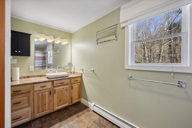 full bathroom featuring vanity, baseboards, baseboard heating, and a wealth of natural light