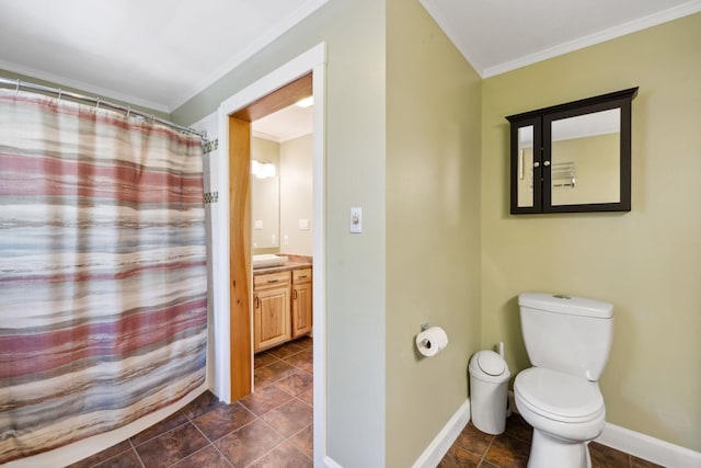 full bathroom featuring vanity, ornamental molding, baseboards, and toilet