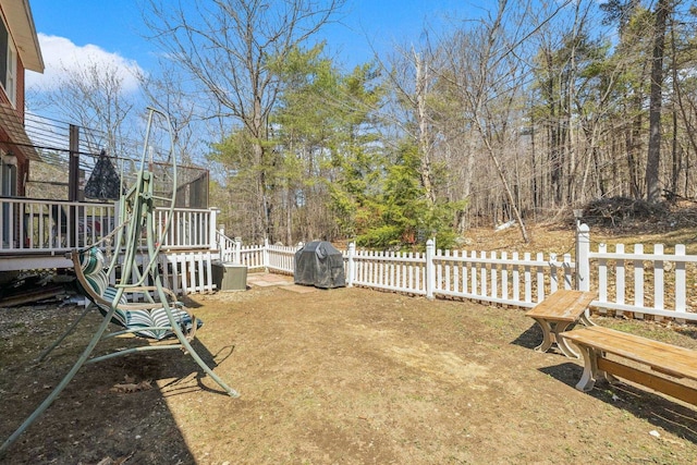 view of yard with fence and a wooden deck
