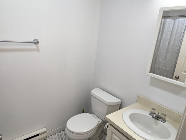264 Main St Unit Q 31, Lincoln, NH 03251 - full bath with vanity, tile patterned floors, baseboard heating, and toilet