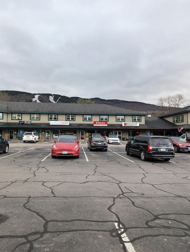 264 Main St Unit Q 31, Lincoln, NH 03251 - view of building exterior with uncovered parking