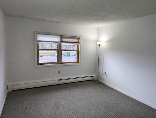 264 Main St Unit Q 31, Lincoln, NH 03251 - carpeted empty room featuring baseboards, a textured ceiling, and baseboard heating