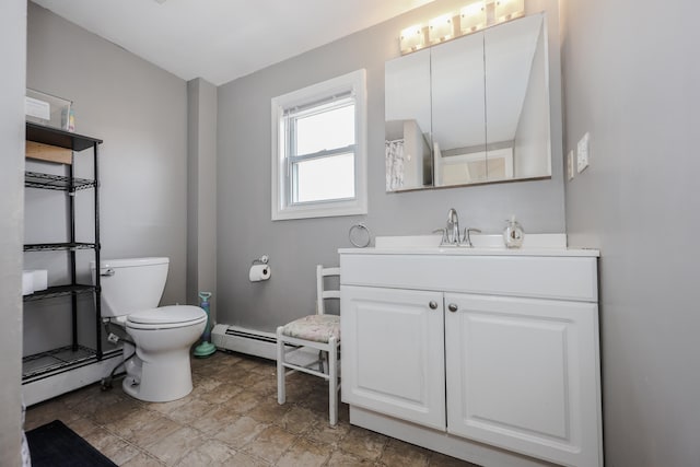 bathroom with vanity, a baseboard radiator, and toilet