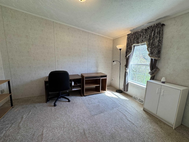 carpeted home office featuring ornamental molding, a textured ceiling, and visible vents