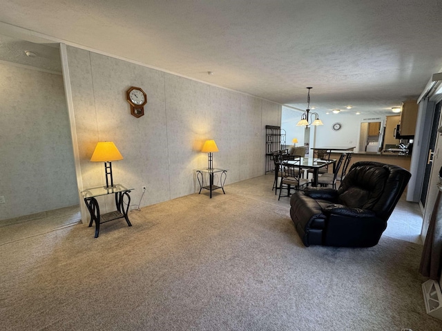 carpeted living area with a textured ceiling