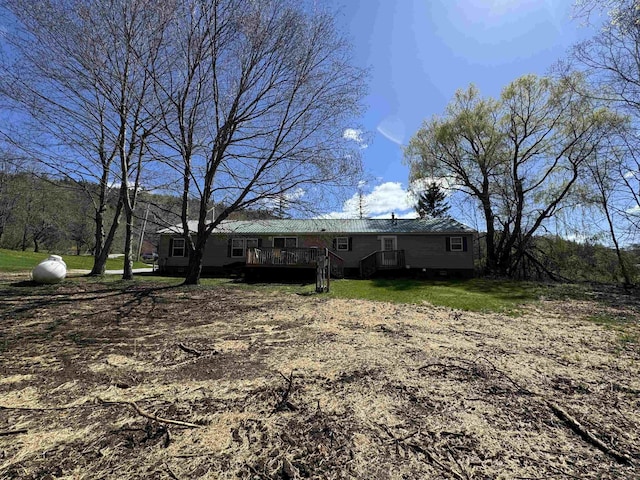 view of yard with a wooden deck
