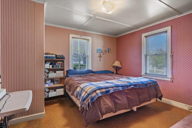 bedroom featuring baseboards, ornamental molding, and carpet