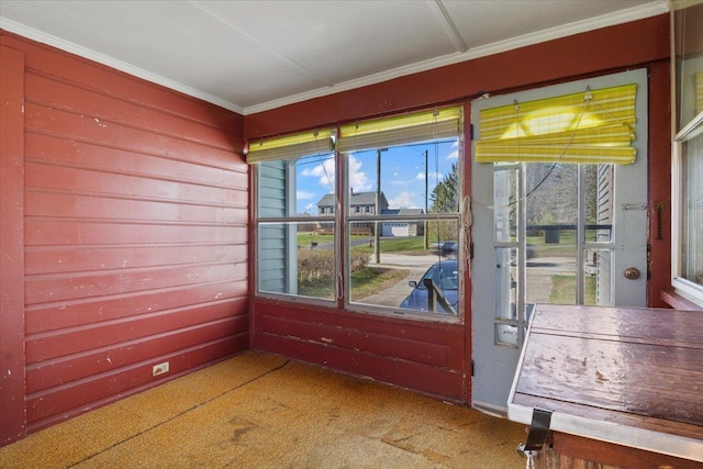 spare room with crown molding