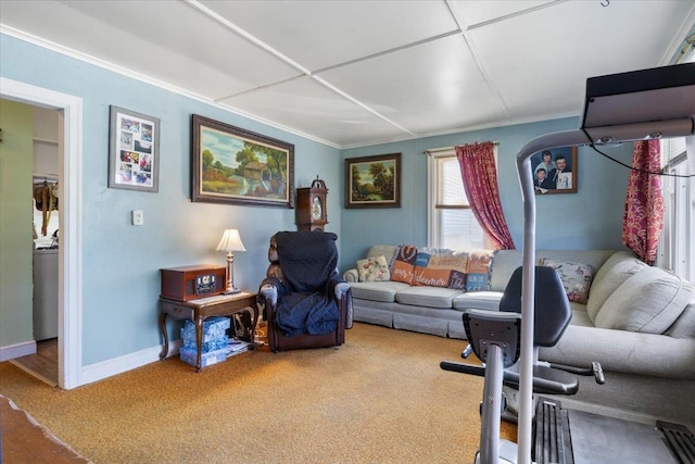 carpeted living room with crown molding and baseboards