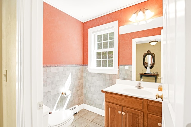 bathroom with tile patterned flooring, vanity, toilet, tile walls, and a baseboard heating unit