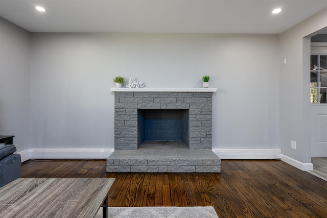 interior details with recessed lighting, baseboards, baseboard heating, and wood finished floors