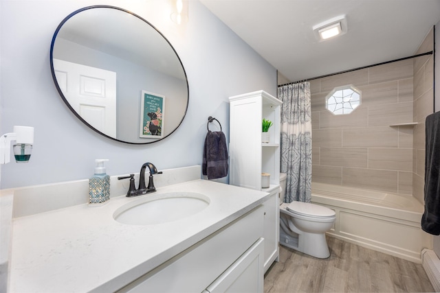 full bathroom with vanity, shower / tub combo with curtain, wood finished floors, and toilet