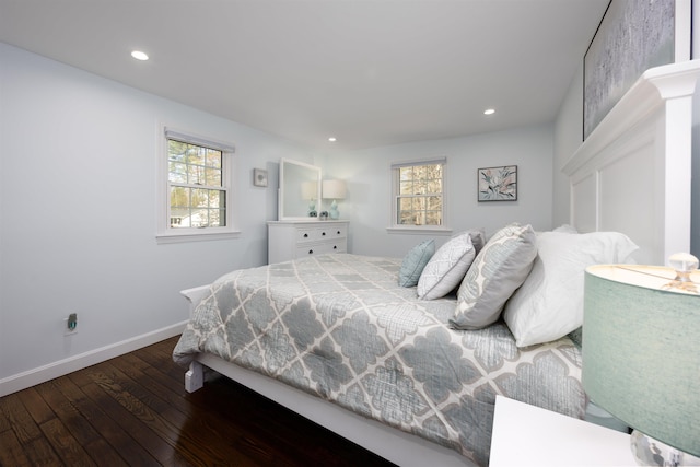 bedroom featuring baseboards, multiple windows, recessed lighting, and hardwood / wood-style floors