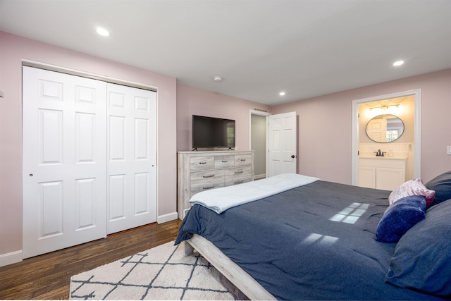 bedroom with wood finished floors, baseboards, a closet, connected bathroom, and recessed lighting