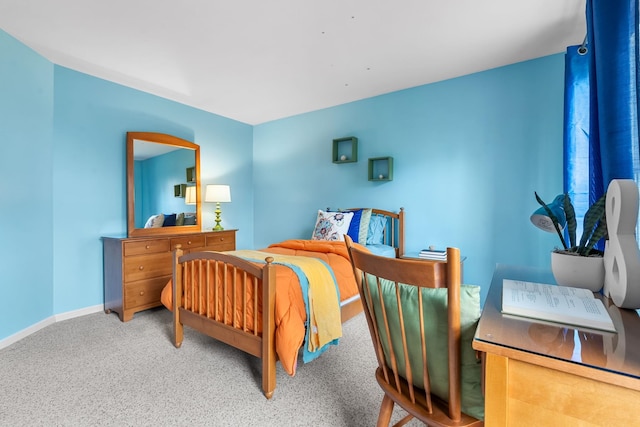 bedroom with baseboards and carpet flooring