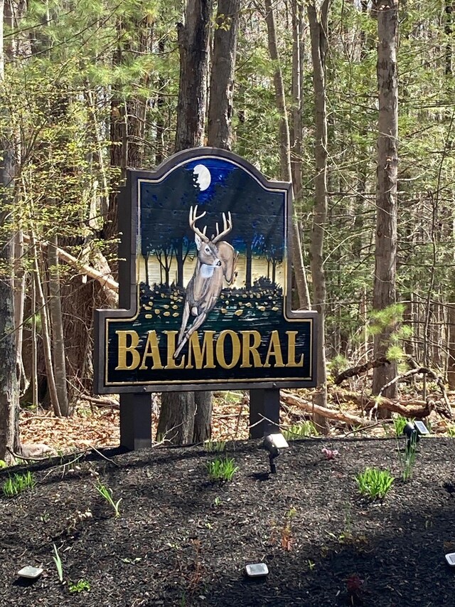community sign with a view of trees