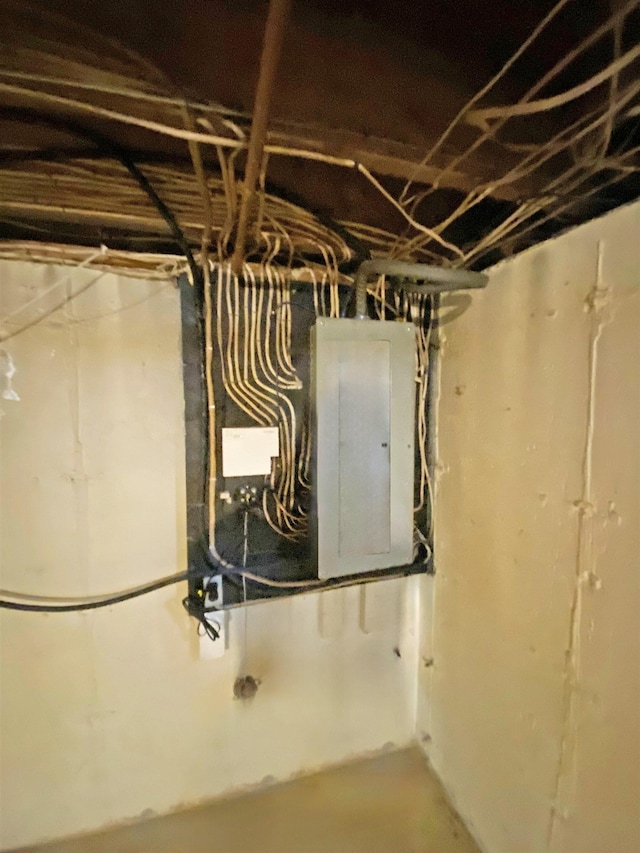 unfinished basement featuring electric panel