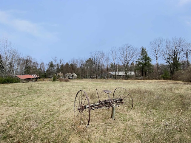 view of yard with a rural view