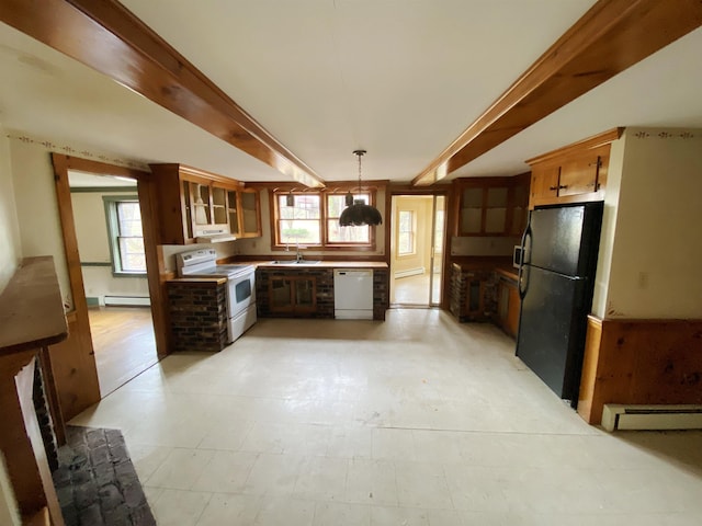 kitchen featuring white appliances, under cabinet range hood, a baseboard heating unit, and a sink