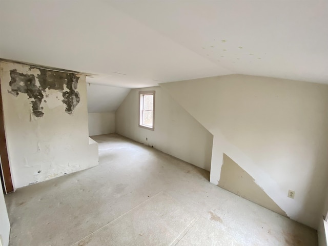 additional living space with vaulted ceiling