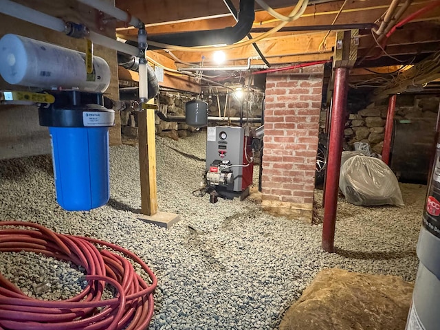 unfinished below grade area featuring a heating unit