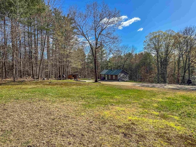 view of yard with a forest view
