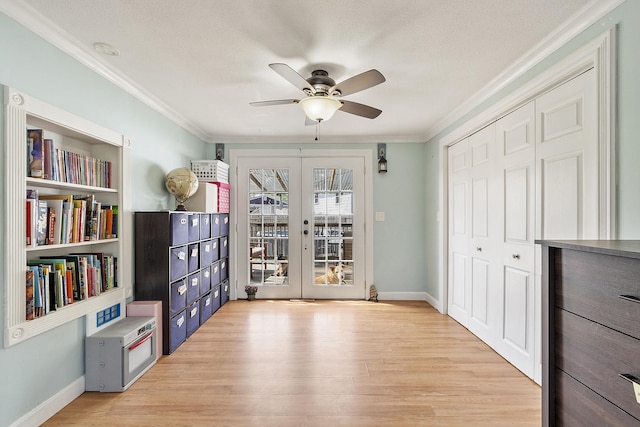 unfurnished room with ceiling fan, ornamental molding, french doors, and wood finished floors