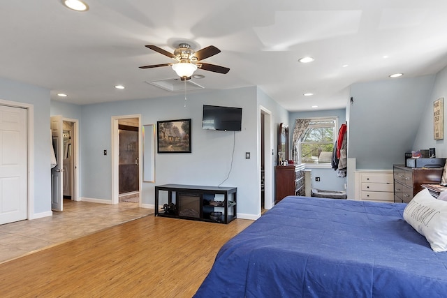 bedroom featuring recessed lighting, a ceiling fan, baseboards, and wood finished floors