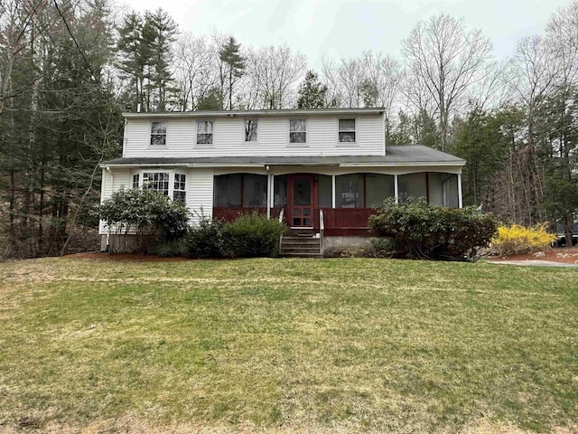 12 Nathaniel Dr, Amherst, NH 03031 - view of front of home featuring a sunroom and a front lawn