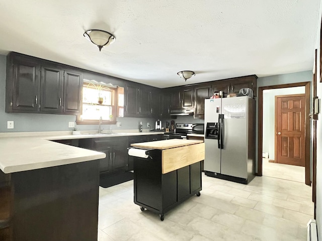 12 Nathaniel Dr, Amherst, NH 03031 - kitchen with light countertops, appliances with stainless steel finishes, under cabinet range hood, and a sink