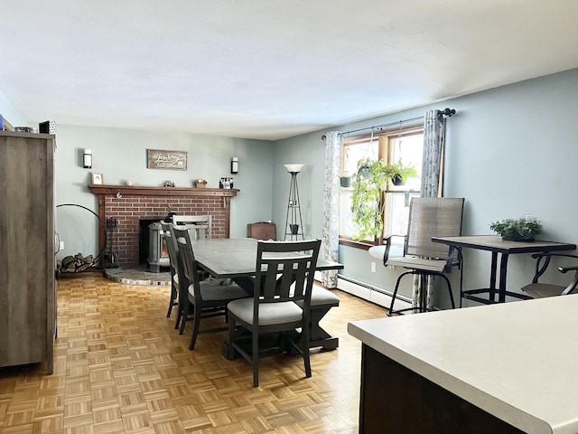 12 Nathaniel Dr, Amherst, NH 03031 - dining area featuring a brick fireplace and a baseboard heating unit