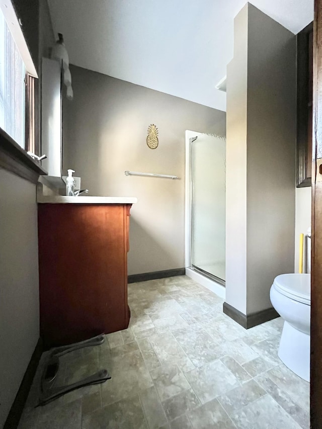 12 Nathaniel Dr, Amherst, NH 03031 - bathroom featuring vanity, toilet, baseboards, and a stall shower