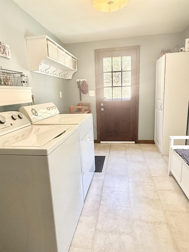 12 Nathaniel Dr, Amherst, NH 03031 - washroom featuring baseboards, cabinet space, independent washer and dryer, and light tile patterned floors