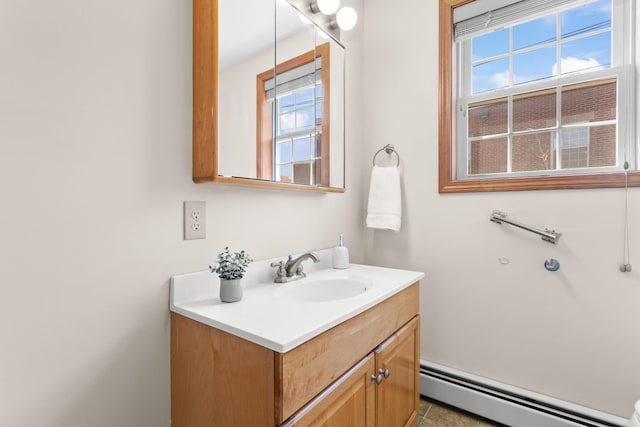 bathroom with vanity and a baseboard heating unit