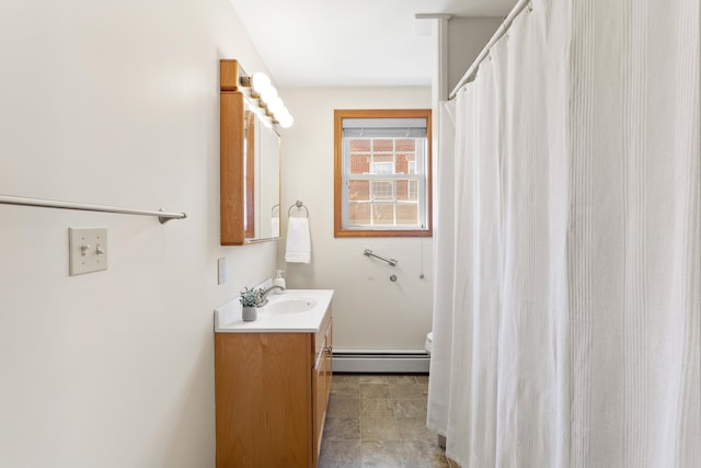 bathroom with toilet, a baseboard heating unit, a shower with shower curtain, and vanity