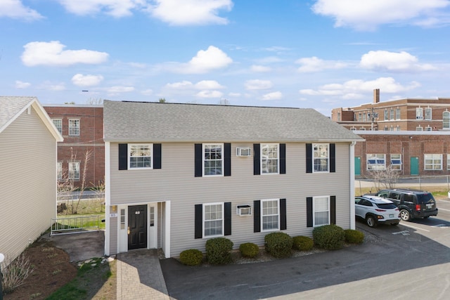 view of front of property featuring uncovered parking