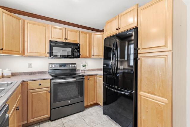 kitchen featuring light tile patterned floors, light brown cabinets, and black appliances